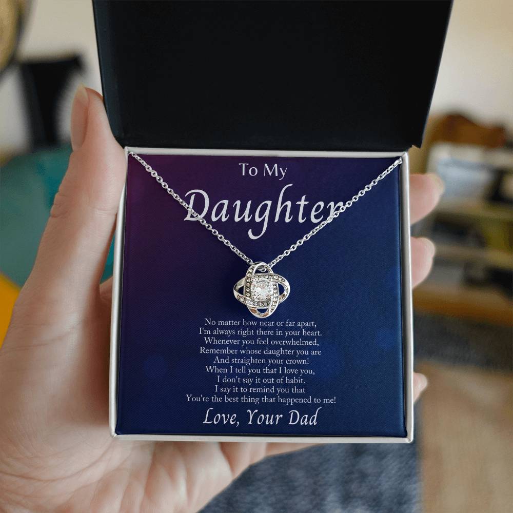 Beautiful love knot necklace presented in gift box for daughter with heartfelt message from dad.
