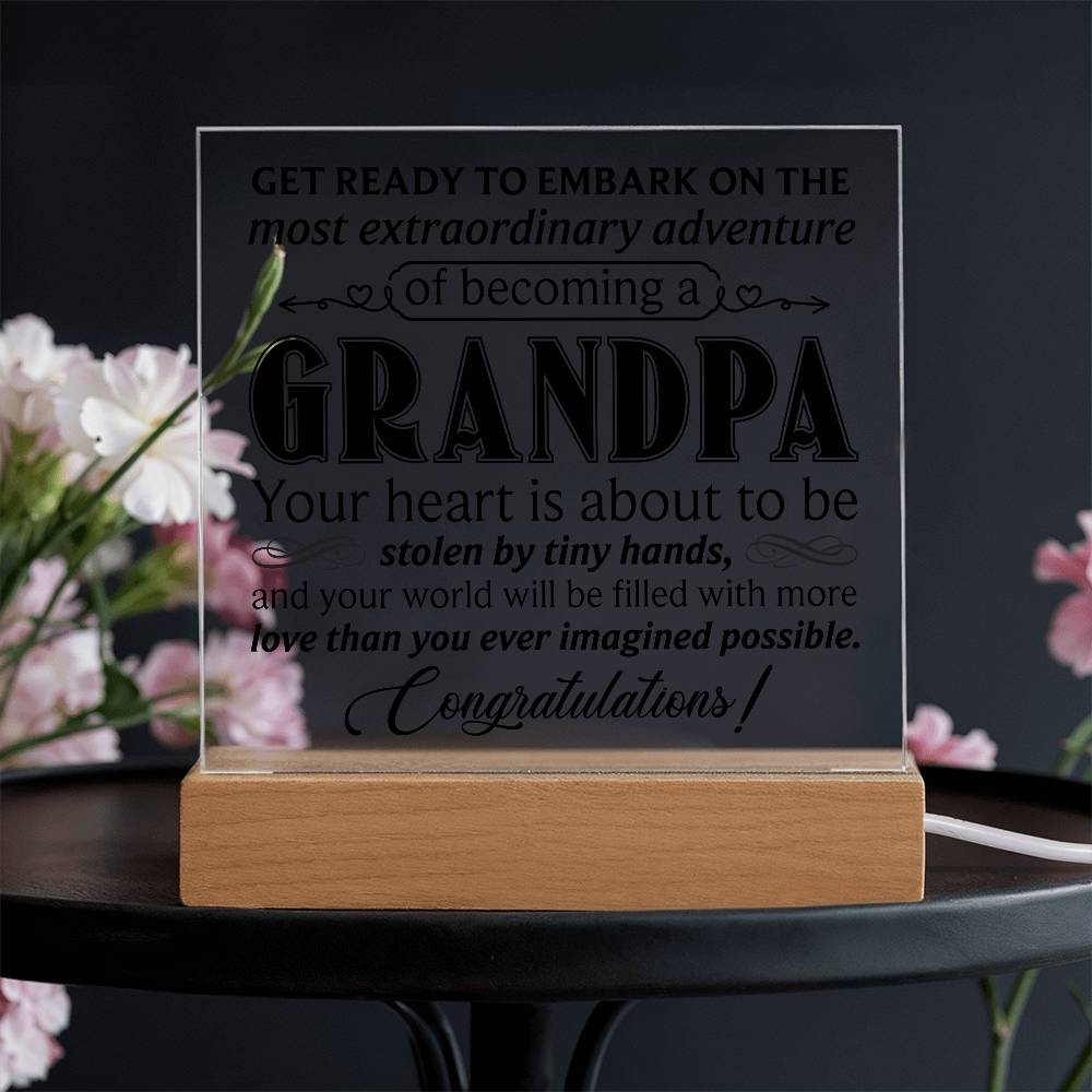 Grandpa acrylic square plaque displaying heartfelt message about becoming a grandparent on a wooden base.