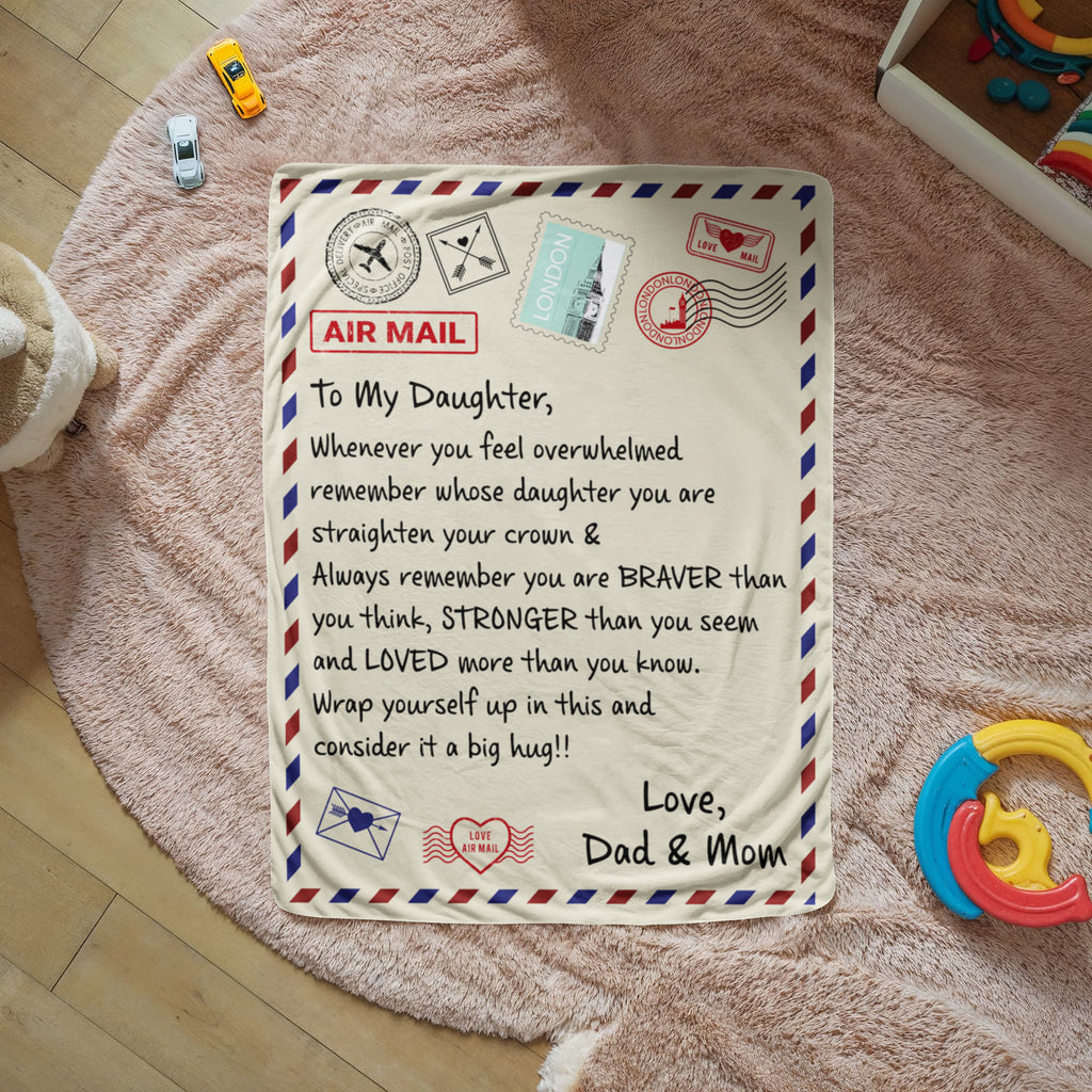 Sherpa fleece blanket for daughter with heartfelt message from Dad and Mom in cozy room setting.