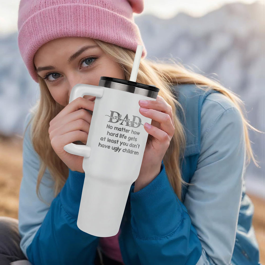 Woman holding a DAD tumbler with a humorous quote, featuring a 40oz stainless steel tumbler design.