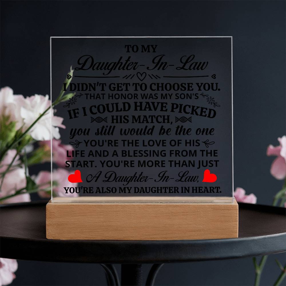 Acrylic plaque for daughter-in-law displaying a heartfelt message on a wooden base with floral backdrop.