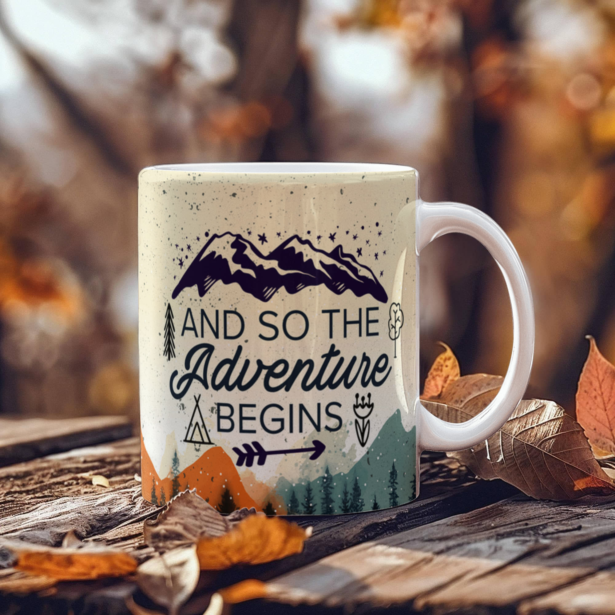 custom ceramic coffee mug with mountain design and text 'And so the Adventure begins' on a wooden surface.