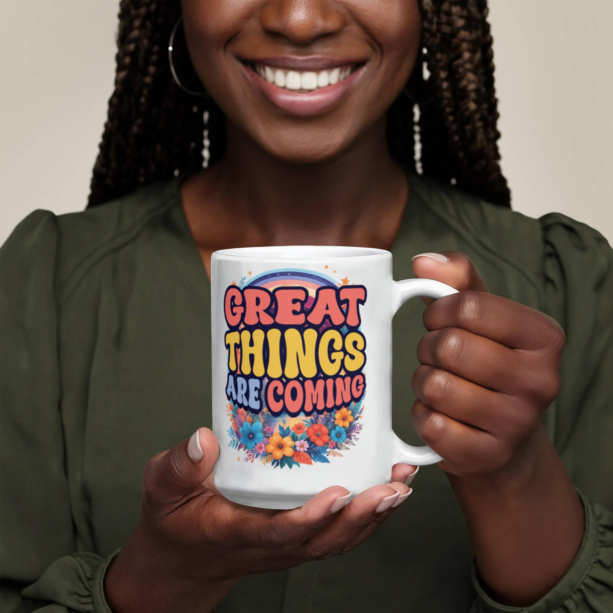 custom ceramic coffee mug displaying 'Great Things Are Coming' in vibrant colors held by a smiling person.