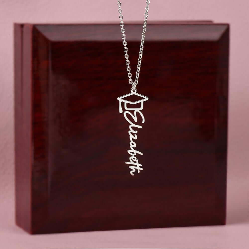 Personalized Graduation 2026 Name Necklace Gift for Her Him displayed on a wooden box with a name design.